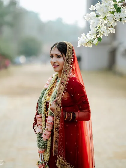 A beautiful profile shot of the bride, with her veil gently blowing in the breeze.