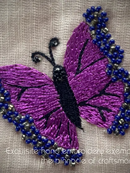 This exquisite hand-embroidered butterfly in purple and blue exemplifies the pinnacle of craftsmanship that my artisans bring to every creation.