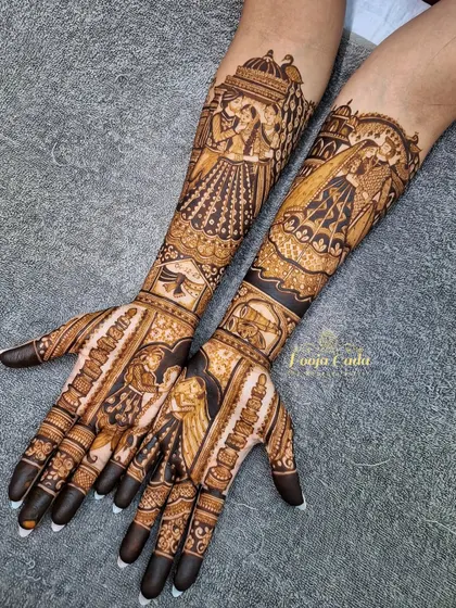 A heavy bridal design filled with figures, including the bride's entry in a doli and a portrait of the couple.