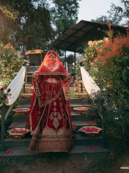 A divine bridal portrait. The lighting, the pose, the stunning red lehenga, everything came together to create this breathtaking shot.