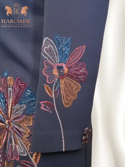 This image highlights the intricate, multi-colored floral embroidery on the sleeve of a Jodhpuri jacket. It’s a perfect example of how I blend desi roots with global trends.