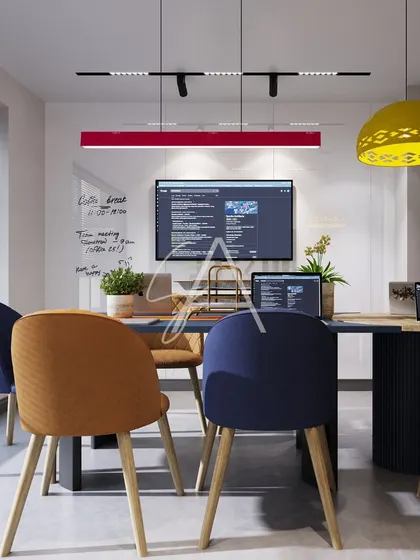 A different angle of the vibrant meeting room, showing the writable glass wall for brainstorming sessions. The combination of functional elements and playful design makes this a truly effective creative space.