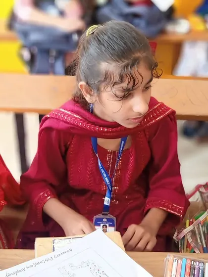 A young artist in our drawing competition at Amara Vidya Niketan, focused and ready to create. We provide a platform for children to express their unique artistic talents and build confidence in their abilities.
