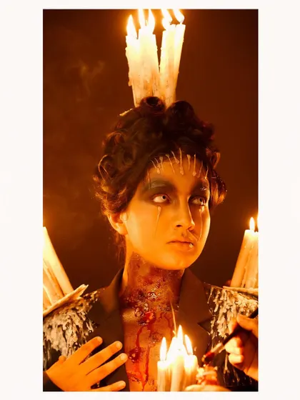 A close-up from the dark fantasy shoot, showing the intricate makeup details, including simulated blood and wax. This is an example of our most artistic and conceptual work.
