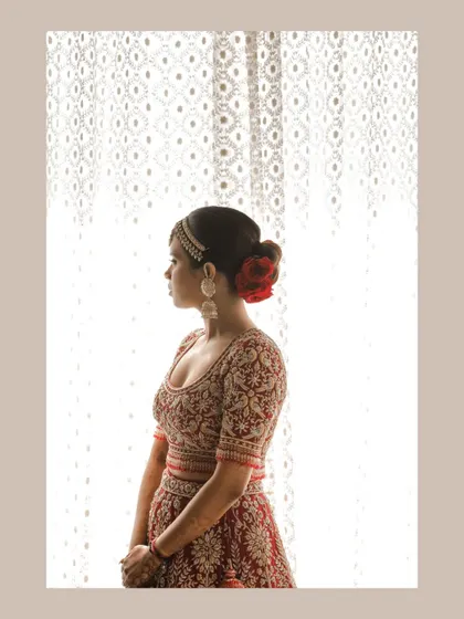 A silhouette-style bridal portrait against a window, creating a soft and dreamy look.
