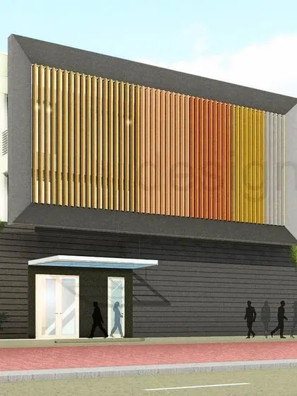 An alternative facade design for a factory project in Lucknow. This version uses colorful vertical fins to create a more dynamic and visually interesting exterior, moving away from the typical industrial look.