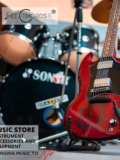 A classic rock setup featuring a red SG-style electric guitar in front of a Sonor drum kit, representing the wide range of gear we offer.
