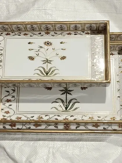 Exquisite serving trays with intricate floral designs, another example of the unique home decor items available.