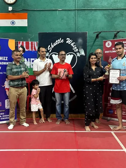 A player receives his award at the in-house tournament, a culmination of his hard work and dedication during training.
