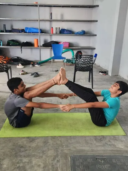 A duplicate of a previous image, showing two older campers in a strong partner boat pose.
