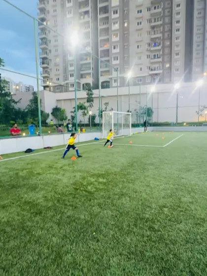 A shooting drill in progress at our facility with high ceilings and excellent lighting. We offer top-notch infrastructure for our players.