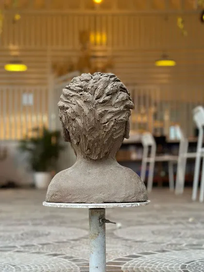 The back of the sculpted bust, showing the detailed, hand-carved texture of the hair. Even the parts you don't always see are crafted with care.