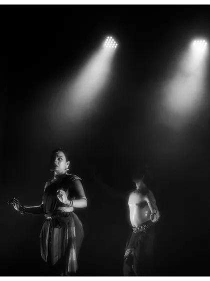 A black and white shot from 'Naga Mandala' that captures the stark, dramatic lighting we use. The interplay of light and shadow is central to this production's aesthetic.