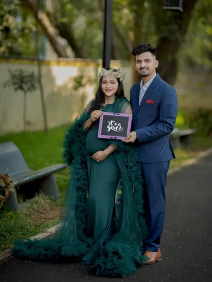A proud dad-to-be joins in for a gender reveal photo. These are fun and exciting shots to include in your session.