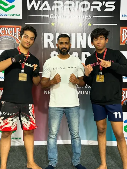 Two of our rising stars with their gold medals and their coach. This is what happens when young talent meets expert guidance and a lot of hard work.