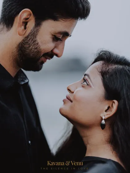An intimate close-up portrait that focuses on the silent conversation between a couple, highlighting the emotion in their eyes.