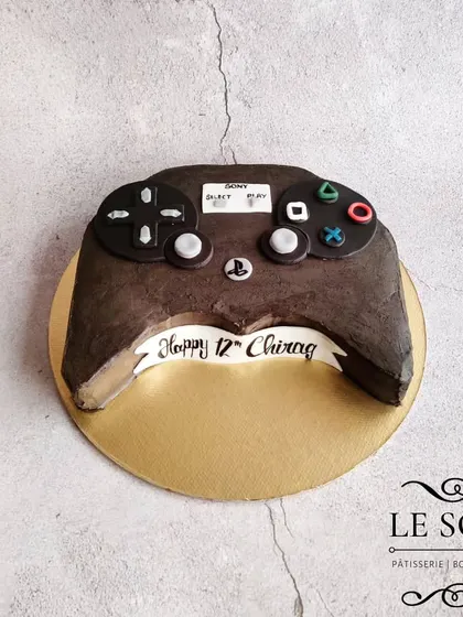 This PlayStation controller cake was carved with absolutely zero cake wastage. It's a half-kg Chocolate Truffle cake, perfect for a gamer's birthday.