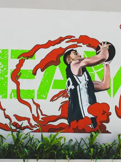 Close-up shots of the hyper-realistic basketball players in action. We focused on capturing the motion and intensity of the sport, blending realistic figures with abstract, energetic splashes of color.