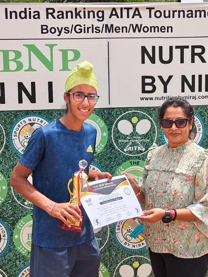 Gurrshan Mehta receiving his trophy after winning his first Singles title at the U14 Championship series in Delhi.