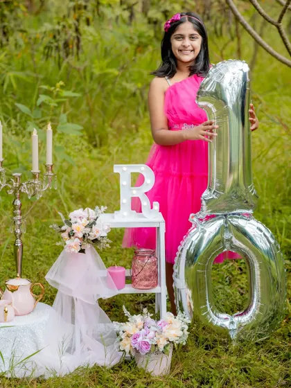 From her first birthday to her tenth, it has been an honor to capture this young lady's journey. This outdoor setup for her tenth birthday was elegant, fun, and perfectly her.