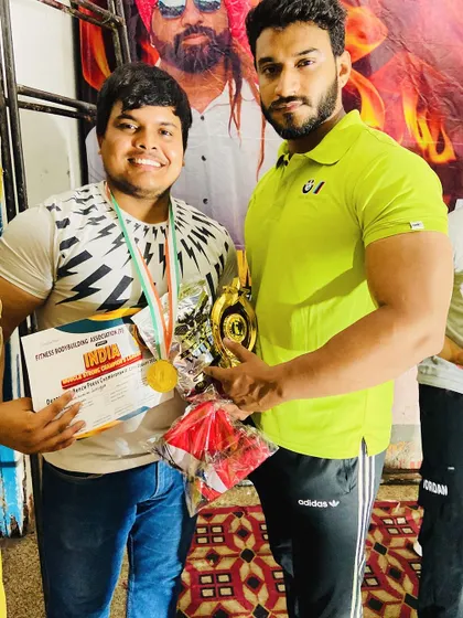 With my 'bade bhai' and student after his win. I stand by my team through every prep and every competition.