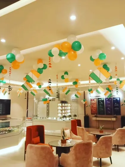 Another angle of the Independence Day office setup, showing how our ceiling decorations create a cohesive and celebratory atmosphere throughout the entire space, from the reception to the seating areas.