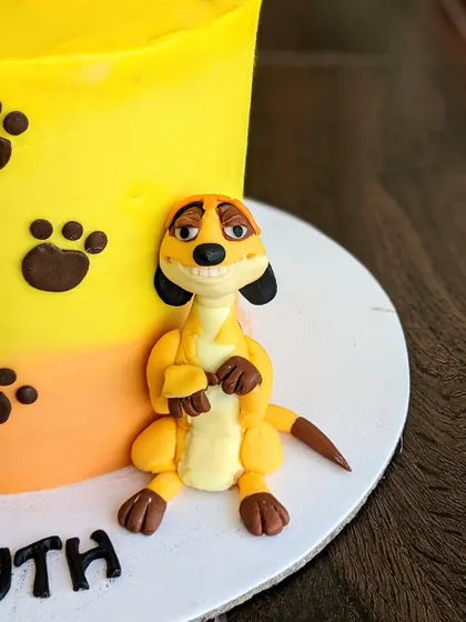 Another look at the detailed Timon topper. Creating these beloved characters from The Lion King is always a joy.