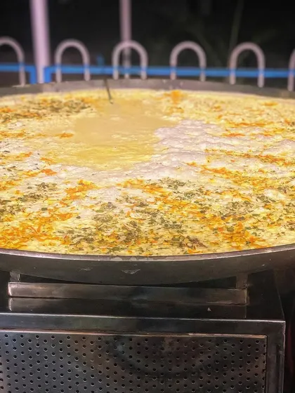 Perfect for a winter wedding, this is our live Kadhai Milk station. We simmer fresh milk for hours in a large kadhai with saffron, cardamom, and nuts until it's thick, creamy, and fragrant.