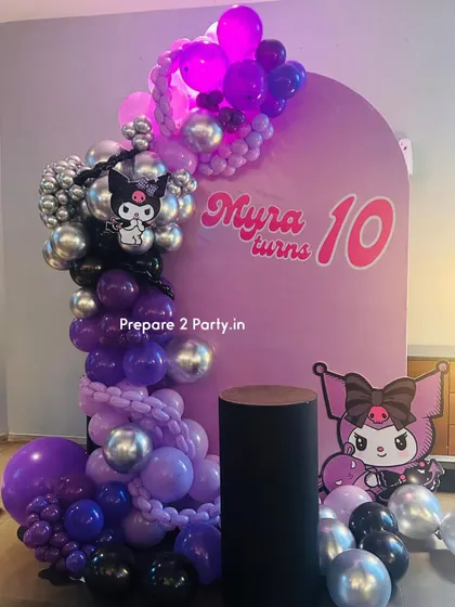 A trendy and edgy Kuromi theme for a 10th birthday. This decoration uses a palette of purple, black, and silver, with a custom arch backdrop, character cutouts, and a modern balloon garland.