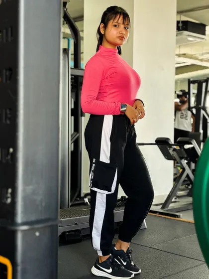 Posing in the gym. My goal is to show that you can be strong and stylish. Fitness is a lifestyle that extends beyond the workout itself.