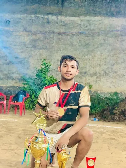Posing with the collection of trophies won at the Ujada Modinagar tournament.