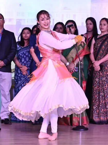 A photo from a stage performance, capturing a dynamic moment of a classical spin. This is where I feel most alive, bringing art to the stage for an audience.