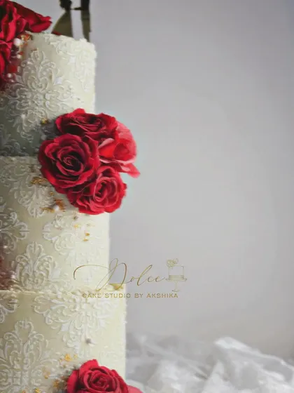 We're still looking for a name for this beauty. The contrast between the deep red roses and the detailed ivory stencil is just stunning.