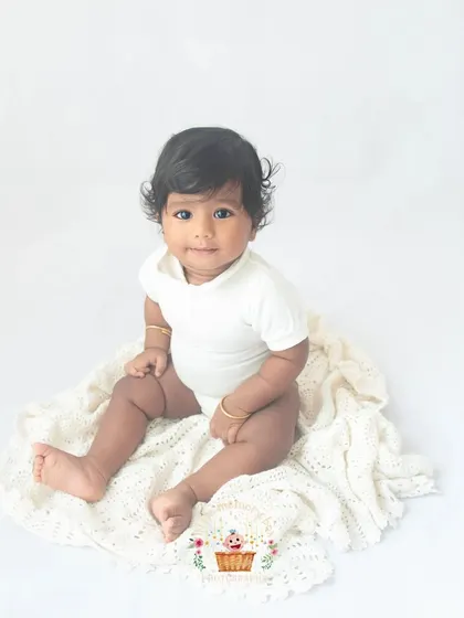 Look at those beautiful eyes. Sitter sessions are so special because your baby's personality is really starting to shine. My minimalist white backdrop ensures nothing distracts from their adorable expressions.