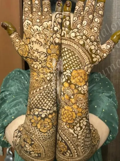 A close up of a bride's hands, showing a unique floral design with a mix of filled and empty spaces for a 3D effect.