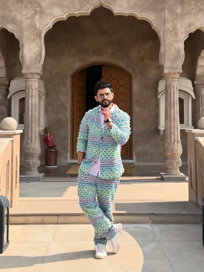Posing in front of a grand entrance. The outfit and the architecture complement each other perfectly.