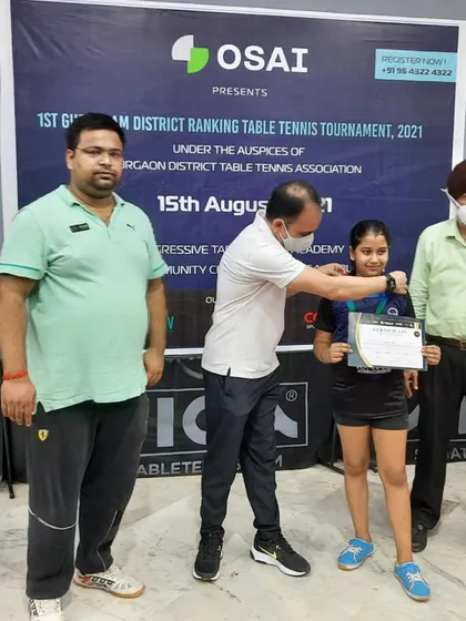 Varya receiving her gold medal at the Gurgaon District Ranking Tournament. It's amazing to see such incredible results with just six months of dedicated table tennis training.