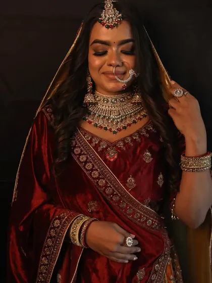 A closer look at the beautiful craftsmanship of the bridal lehenga and the matching jewellery set. Every detail is designed to make you feel special.