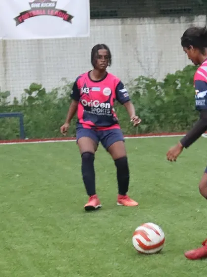 Players from our girls' team engaged in a midfield battle during a TGIF league match. Teamwork and positioning are crucial elements of our game plan.