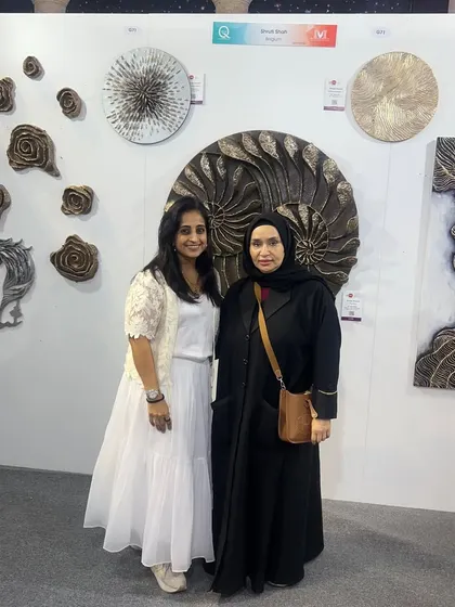 It's always an honor to meet fellow art lovers. Posing with a visitor at my booth during the art show in Qatar.