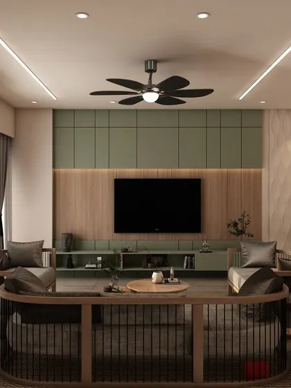 We designed this living room with a unique curved sofa and a striking green accent wall behind the TV. The mix of wood, metal, and soft fabrics creates a rich, layered look.