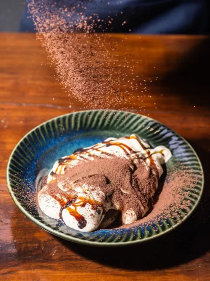 Another look at my tableside Tiramisu, with a generous dusting of cocoa powder. It's a crowd favorite and always the right choice for a sweet treat.