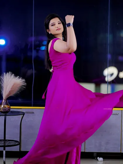 A dynamic shot showing off the flow of the gown. The makeup is designed to look flawless from a distance, with enough definition to stand out in a full-length photo.