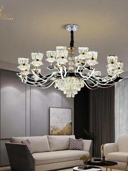 The Manila Chandelier installed in a living room, showcasing its grand size and modern elegance. The smart features make it as functional as it is beautiful.