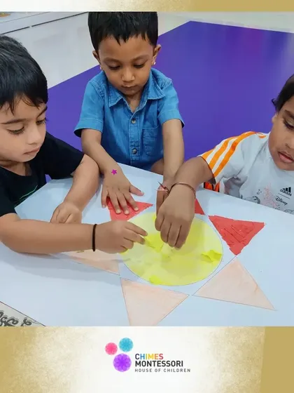 On World Art Day, children work together on a large sun collage, learning about collaboration and color.