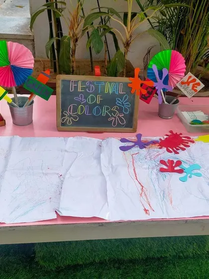 A 'Festival of Colors' invitation to play set up for our Holi celebrations. With paints, crayons, and paper, children were invited to explore color and express their creativity in anticipation of the festival.