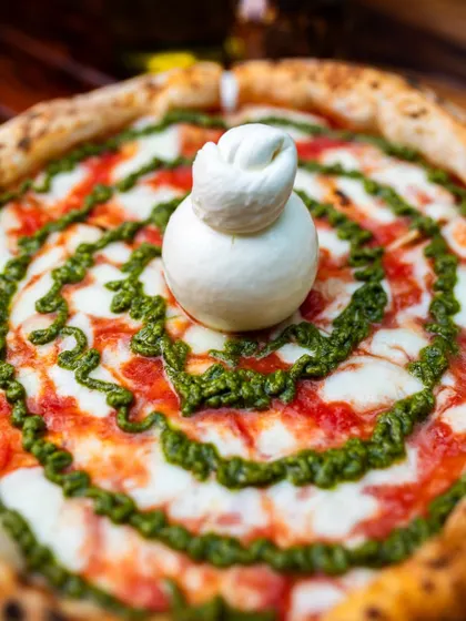 Our Burrata Pesto pizza is a work of art. Creamy, herby, and absolutely delicious.