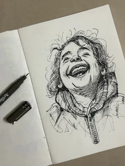 The pure joy of a child's laughter, captured in a quick and expressive pen sketch in my notebook. I love the raw energy of ink on paper.