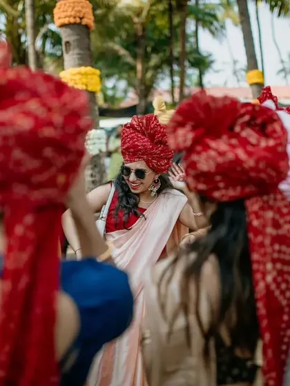 A guest enjoying the baraat, her energy and joy perfectly captured. It's all about the vibe of the day.