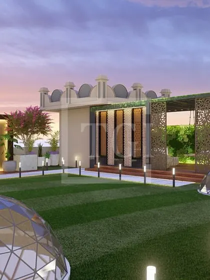 Another view of the grand Jaipur terrace design, showcasing the expansive lawn, architectural domes, and a feature wall with a lotus motif, perfect for large gatherings.